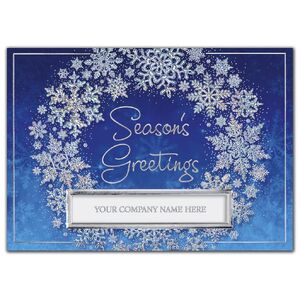 Silver snowflake wreath on blue custom printed holiday greeting cards.