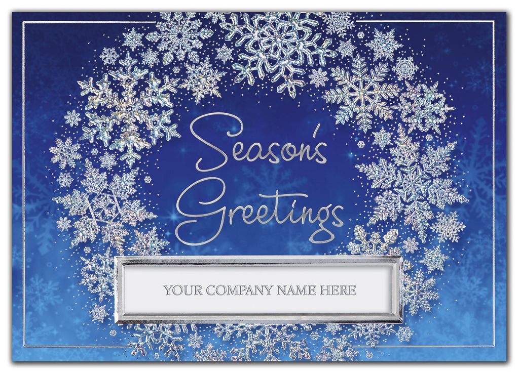 Silver snowflake wreath on blue custom printed holiday greeting cards.