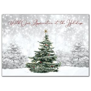 Custom holiday cards with single green tree in snowy forest